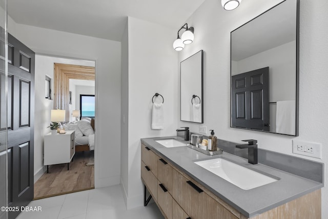 bathroom featuring tile patterned flooring and vanity