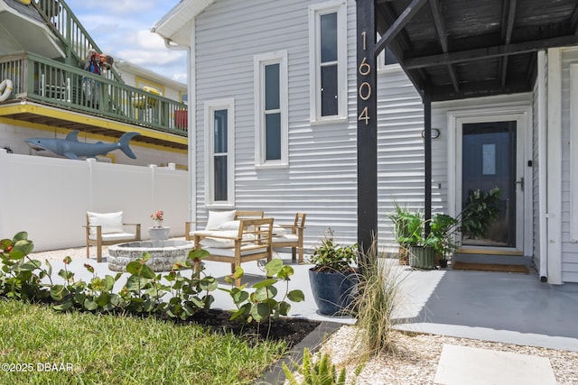 view of exterior entry featuring a patio area