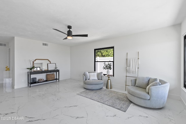 sitting room with ceiling fan