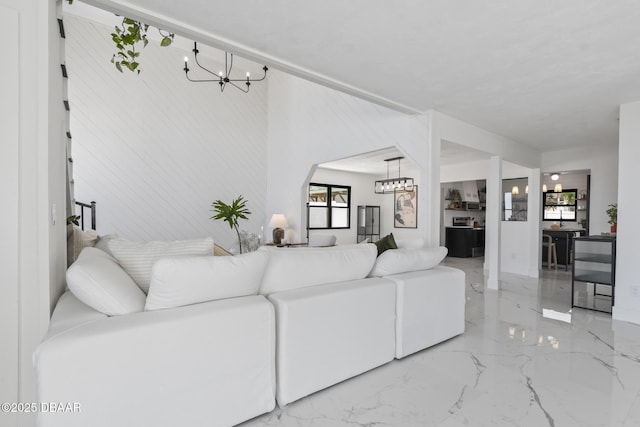 living room featuring a notable chandelier