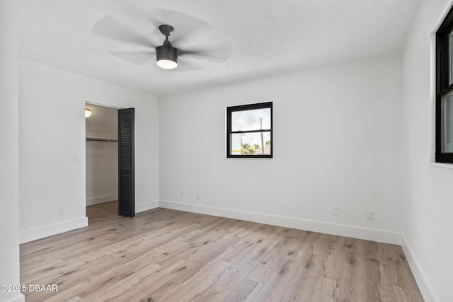 unfurnished bedroom with a closet, ceiling fan, and light hardwood / wood-style flooring