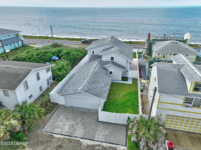 birds eye view of property with a water view