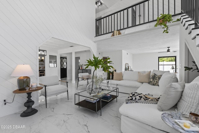 living room featuring a towering ceiling