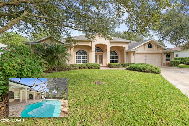 view of front of house with a garage and a front lawn