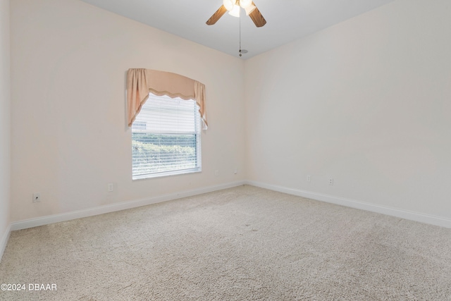 unfurnished room with carpet floors and ceiling fan