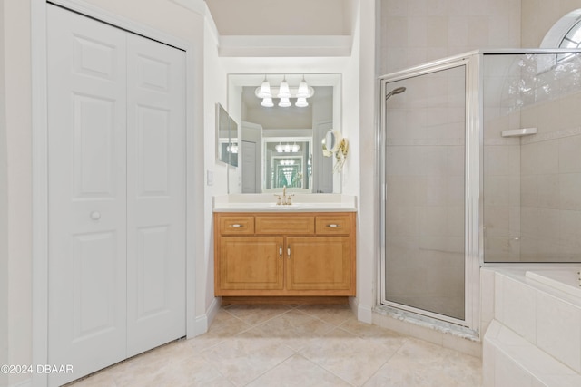 bathroom with shower with separate bathtub, vanity, and tile patterned flooring