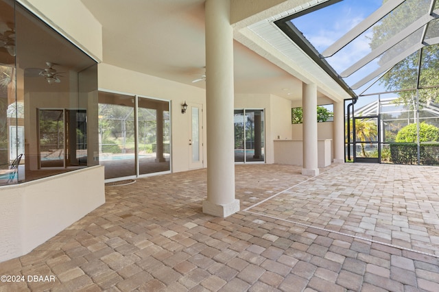 view of patio with a lanai and ceiling fan