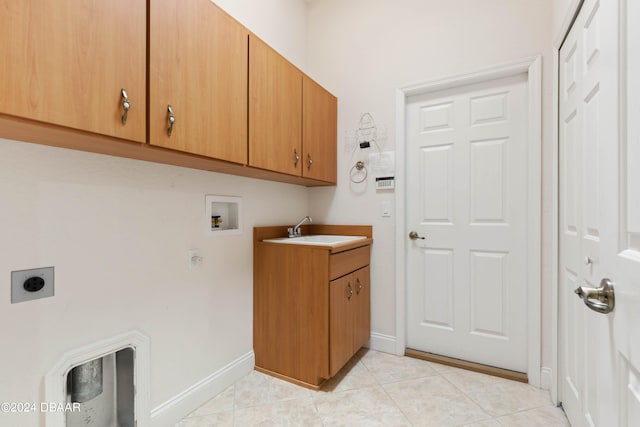 laundry room featuring light tile patterned flooring, washer hookup, cabinets, sink, and electric dryer hookup