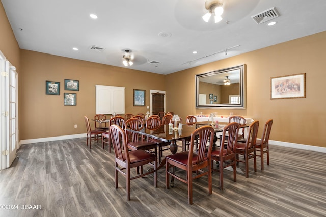 dining room featuring wood-type flooring and ceiling fan