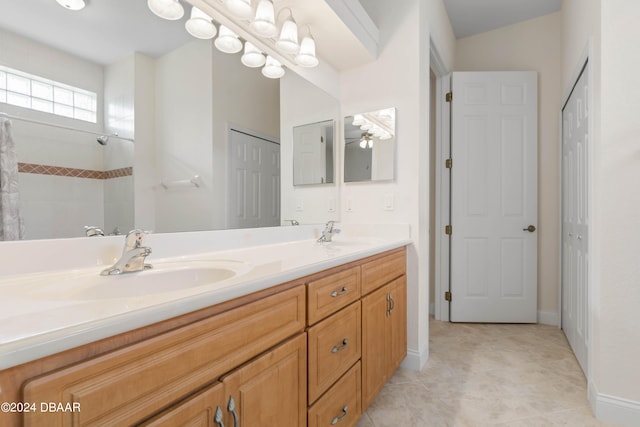 bathroom featuring a shower, vanity, and tile patterned floors