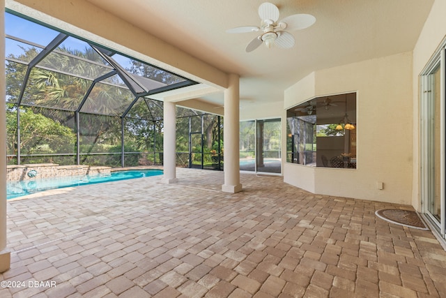 view of patio / terrace with glass enclosure and ceiling fan