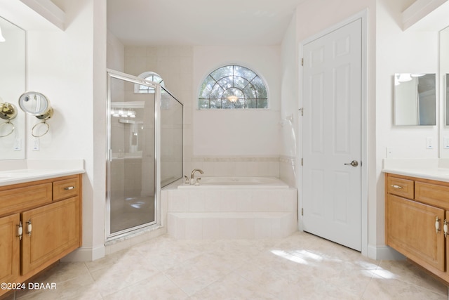 bathroom with tile patterned flooring, vanity, and independent shower and bath