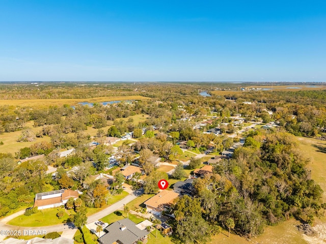 drone / aerial view featuring a forest view