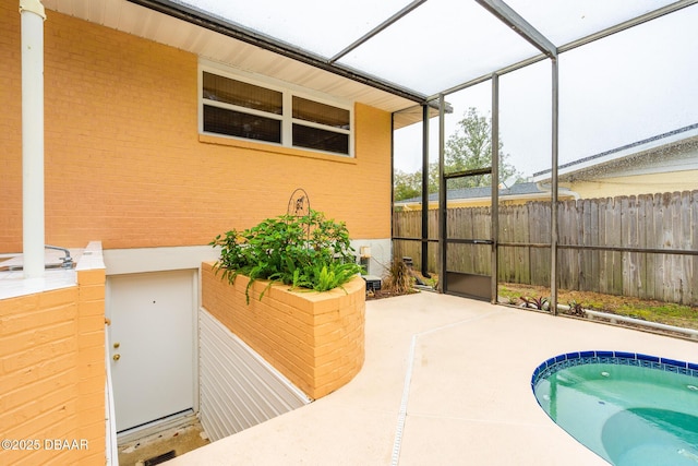 view of pool featuring a patio, a lanai, a jacuzzi, and fence