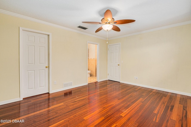 unfurnished bedroom featuring ornamental molding, visible vents, and wood finished floors