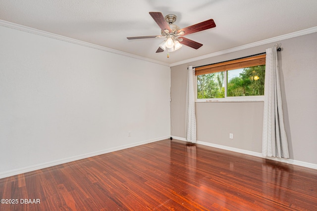 unfurnished room featuring a ceiling fan, crown molding, baseboards, and wood finished floors