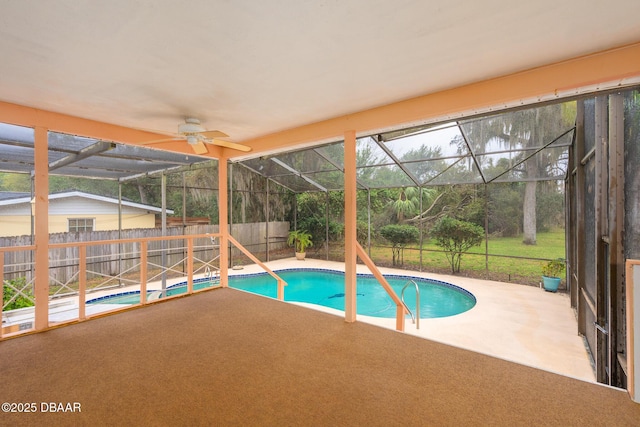 view of pool with a lanai, fence, a ceiling fan, a fenced in pool, and a patio area