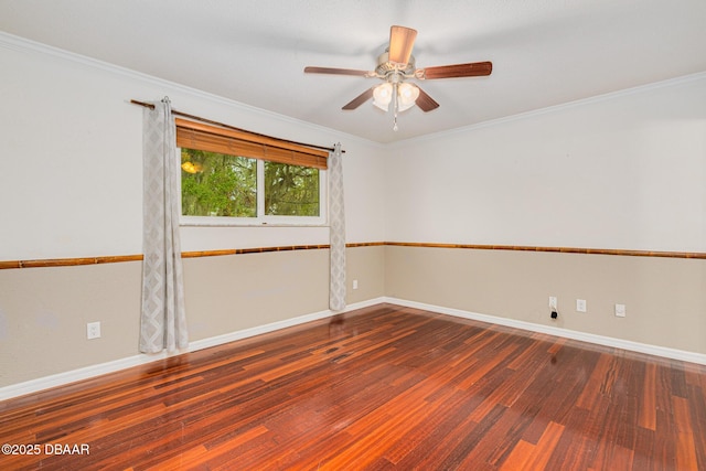 unfurnished room with crown molding, baseboards, and wood finished floors