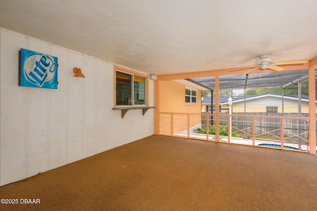 view of patio with a lanai and fence