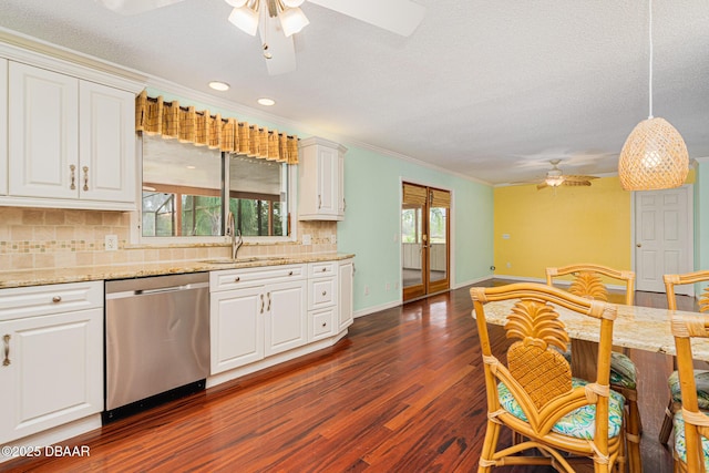 kitchen featuring dark wood-style flooring, a sink, a ceiling fan, stainless steel dishwasher, and decorative backsplash