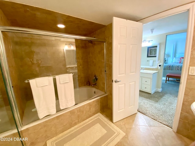 bathroom with vanity, tile patterned flooring, and enclosed tub / shower combo