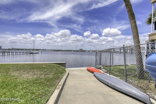 405 N Halifax Ave N Unit 208, Daytona Beach, FL 32118 - view of dock with a lawn, a water view, and fence