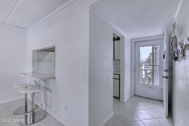 405 N Halifax Ave N Unit 208, Daytona Beach, FL 32118 - interior space featuring crown molding, baseboards, and light tile patterned floors