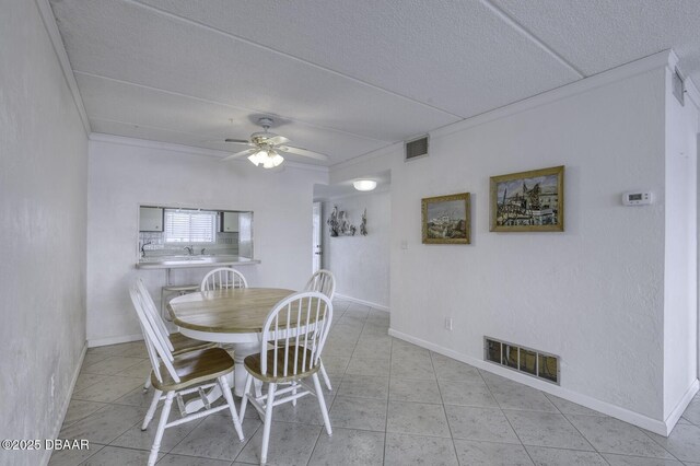405 N Halifax Ave N Unit 208, Daytona Beach, FL 32118 - tiled dining room with visible vents, a ceiling fan, and baseboards