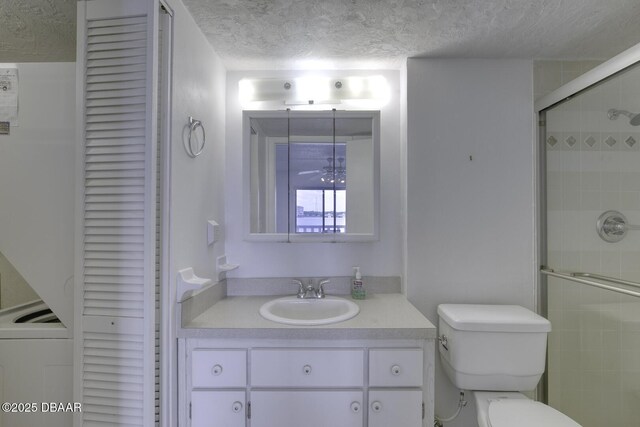 405 N Halifax Ave N Unit 208, Daytona Beach, FL 32118 - bathroom featuring vanity, a closet, toilet, and a textured ceiling