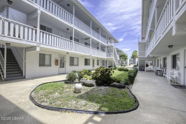 405 N Halifax Ave N Unit 208, Daytona Beach, FL 32118 - view of community featuring stairway