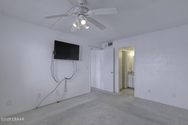 405 N Halifax Ave N Unit 208, Daytona Beach, FL 32118 - unfurnished bedroom with ceiling fan, carpet flooring, connected bathroom, and visible vents