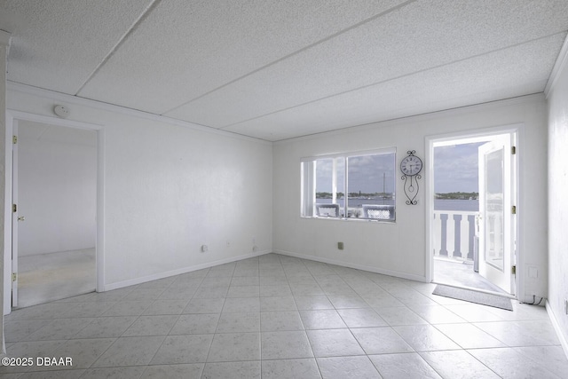 405 N Halifax Ave N Unit 208, Daytona Beach, FL 32118 - empty room with baseboards, a textured ceiling, and light tile patterned floors