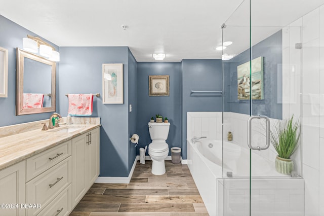 full bathroom featuring shower with separate bathtub, hardwood / wood-style flooring, toilet, and vanity