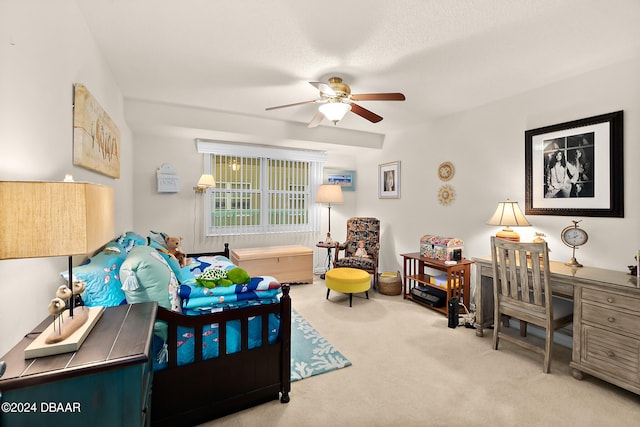 bedroom featuring ceiling fan and light carpet