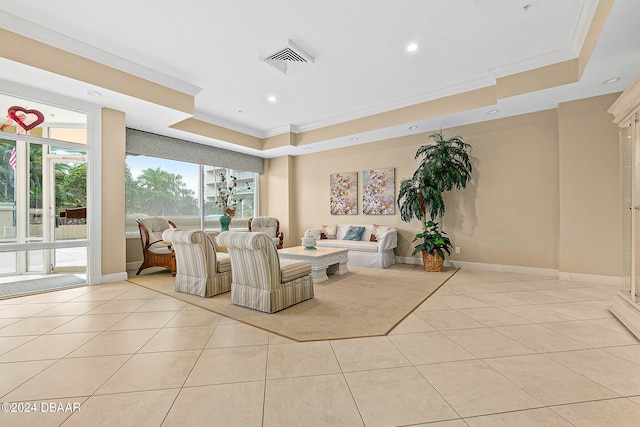 interior space featuring light tile patterned flooring, a raised ceiling, and crown molding