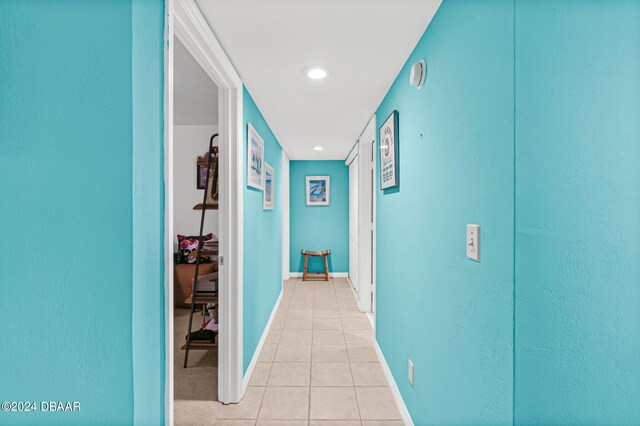 hallway with light tile patterned floors