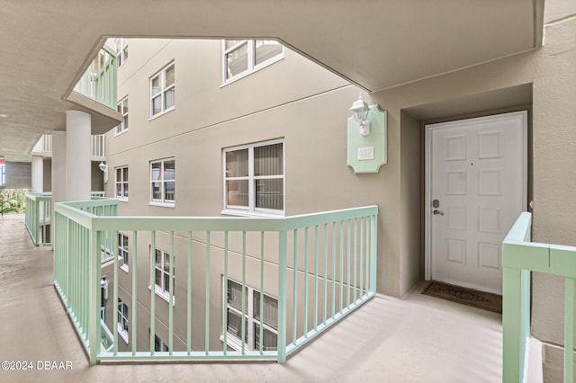 entrance to property with a balcony