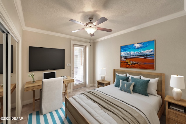 bedroom with a textured ceiling, ornamental molding, ceiling fan, and a closet