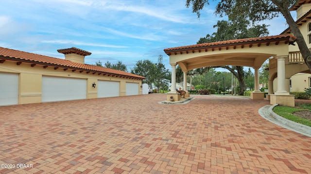 view of patio / terrace with a garage and a carport