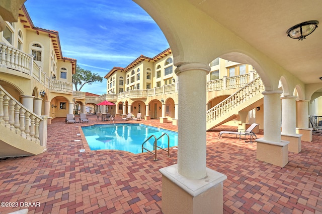 view of pool featuring a patio