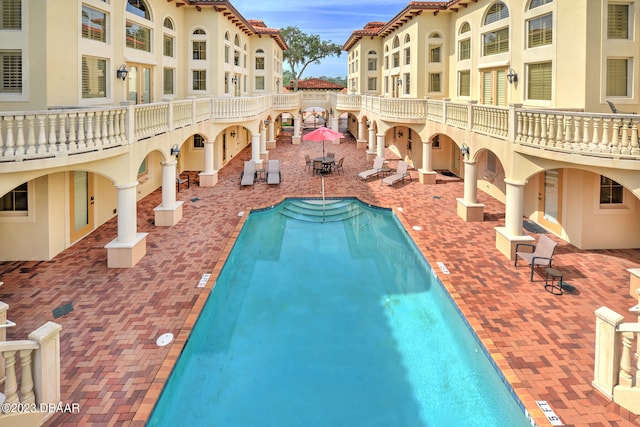 view of swimming pool featuring a patio