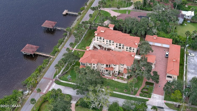 birds eye view of property with a water view