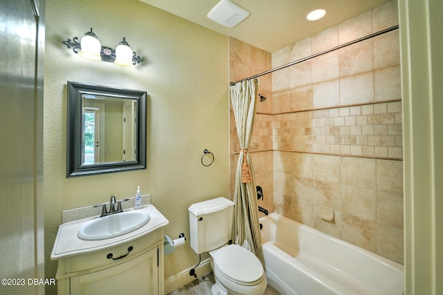 full bathroom with toilet, vanity, shower / bath combination with curtain, and a textured ceiling