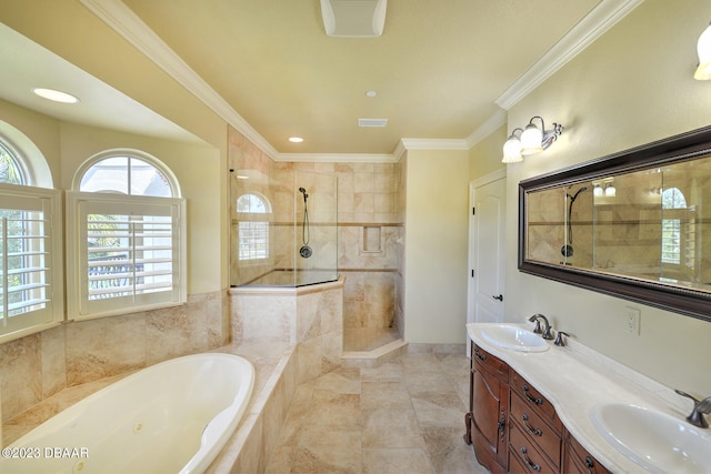 bathroom with ornamental molding, shower with separate bathtub, and vanity