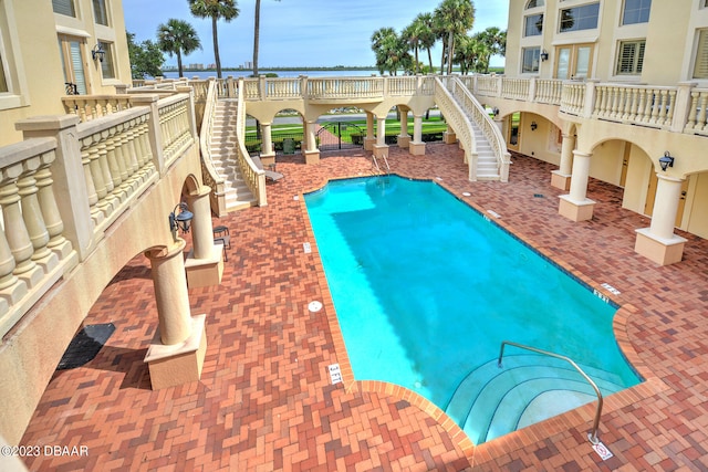 view of swimming pool featuring a patio