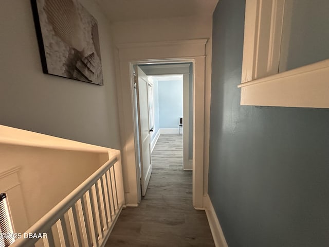 hall with dark wood-type flooring