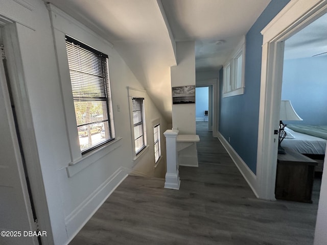 hallway with dark hardwood / wood-style floors