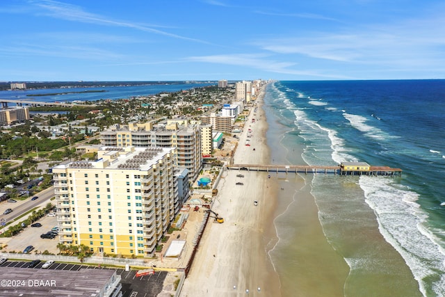 bird's eye view featuring a view of the beach and a water view