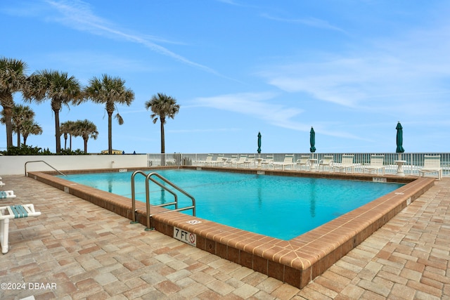 view of pool featuring a patio