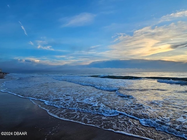 property view of water featuring a beach view